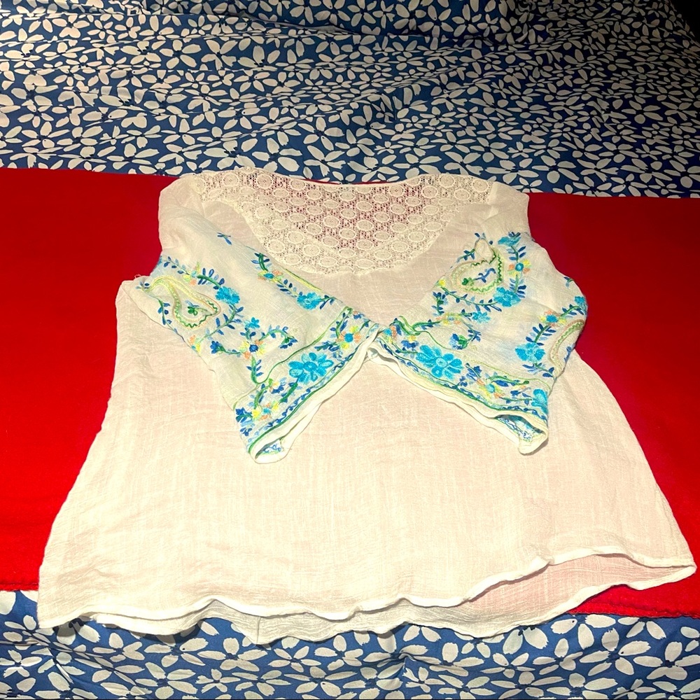 Bohemian top with vibrant stitching on the sleeves